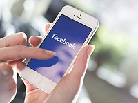 Facebook profit surges but shares tumble