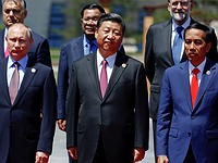 Xi urges world to reject protectionism as he promotes belt and road trade initiative