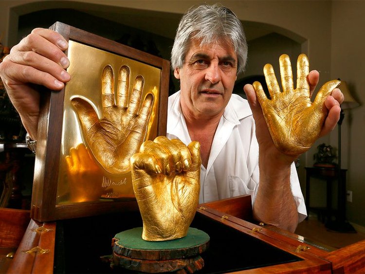 Gold Casts of Mandela's Hands Sell for $10m in Bitcoin